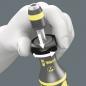 Preview: The image shows a hand holding a screwdriver. The screwdriver has a rubberized grip area with the inscription "Wera". At the top is a torque scale with arrows that illustrate the function.