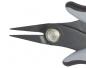 Preview: The image shows the tip of a pair of scissors. The handles are gray and black, and the blade is narrow and pointed. A screw head is visible in the center.