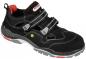 Preview: Das Bild zeigt einen schwarzen Schuh mit zwei breiten Klettverschlüssen. Er hat graue und rote Akzente, eine stabile Sohle und ein sportliches Design, geeignet für Outdoor-Aktivitäten.