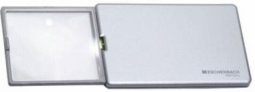 The image shows a practical magnifying glass in a compact, silver casing. The magnifying glass is foldable and has a clear, magnifying lens. It is suitable for better visibility of small text.