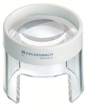 The image shows a magnifying glass with a white, round casing and a clear, curved glass. It has a transparent base that keeps it stable. It is lightweight and easy to handle.