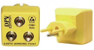 Das Bild zeigt ein gelbes Gerät mit zwei runden Anschlüssen und einem Stecker. Es ist ein Erdungsanschluss, beschriftet mit ?DPV? und ?ESD?, für elektrostatische Entladung.