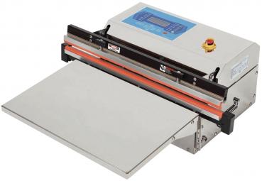 Das Bild zeigt eine elektrische Vakuumverpackungsmaschine. Sie hat eine rechteckige Arbeitsfläche, eine digitale Steuerung auf der Oberseite und einen großen, flachen Deckel.