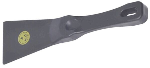 The image shows a narrow spatula with a flat, broad end and a long, ergonomic handle. The handle has a hole for hanging. The color is predominantly dark gray.