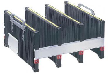 The image shows a black storage box with multiple compartments divided by vertical dividers. The top edge has yellow markings, and the box stands stable on a flat surface.