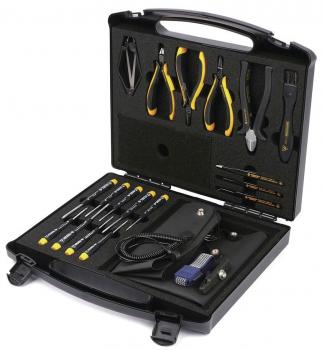The image shows a toolbox with an open lid. Inside, various tools such as screwdrivers, pliers, and a cable are arranged in a padded, structured compartment.