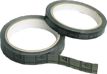 The image shows two rolls of dark tape stacked on top of each other. One roll has a piece of tape unrolled. The tape features a simple, patterned design.