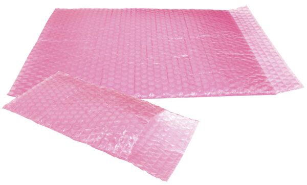 Das Bild zeigt eine große, rechteckige Luftpolsterfolie in leuchtendem Rosa. Die Oberfläche ist mit vielen kleinen, runden Luftbläschen bedeckt, die nach dem Drücken ein Geräusch erzeugen.