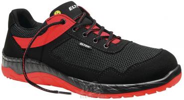 The shoe is a sporty half-shoe in black with red accents. It has a wide Velcro strap and open areas on the side for ventilation. The sole is non-slip and lightweight.