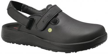 The shoe is a black clog with a closed front and an open back. It features a practical strap and a non-slip sole. The lining is red patterned.