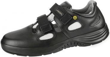 The shoe is white with gray and black details. It has a curved, non-slip sole, two Velcro straps, and breathable inserts. Ideal for comfort and support.