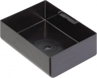 The image shows a rectangular, black plastic box. It has high walls and a smooth surface, with a partition in the middle and a small hole in the bottom.