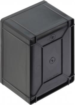The image shows a black, rectangular box with rounded corners. The surface is smooth, and on the front, there is a round slot or a hole for a key.