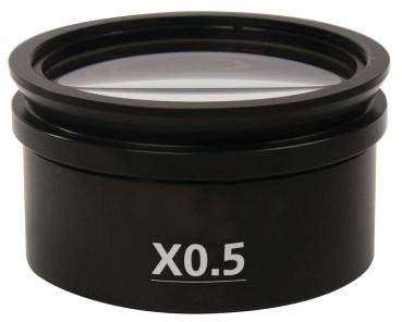 The image displays a black lens with a diameter of about 7 cm. On the front, it is labeled 