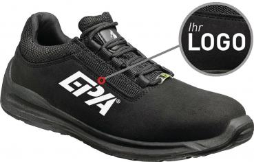 The image shows a black shoe with a simple design. On the side, there is a large, white logo. The shoe features a sporty sole and a padded upper.
