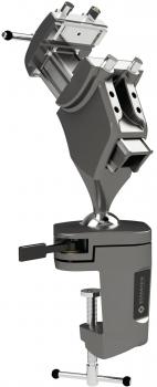 The image shows a gray device with two arms that are connected by a type of joint. There is a solid handle at the bottom and a clamp for attachment.