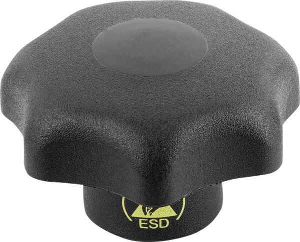The image shows a black, eight-pointed button that is flat on top. In the center, there is a round, smooth surface. At the bottom, a yellow ESD symbol is visible.