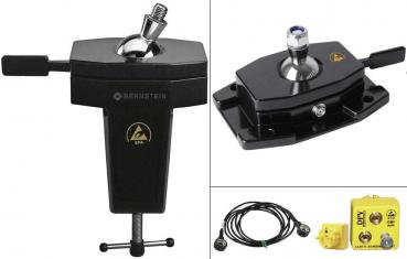The image displays various technical components: a black base with a metallic ball, a yellow control device with two connectors, and a black cable.