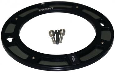 The image shows a round, black metal ring with a narrow, green lens and two markings ("FRONT" and "POL"). It contains three small screws.