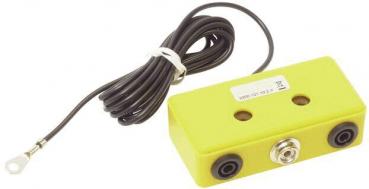 The image shows a yellow, rectangular device with two round openings on the front. It is attached to a long, black cable that leads to a clamp.