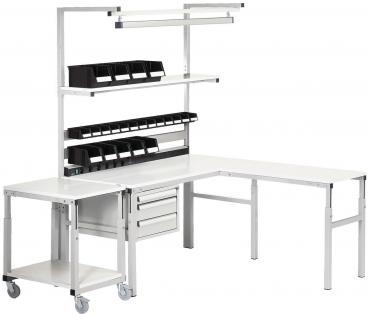 The image shows a modern L-shaped work desk. It has a white tabletop and several shelves. Above are black storage bins, and below are drawers. One side has wheels.