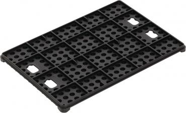 The image shows a black plastic plate with many small holes and rectangular protrusions. The plate is rectangular and has a textured design for stabilization.