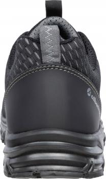 The shoe is a sporty, black sneaker with a breathable mesh surface and a sturdy rubber sole. The heel is reinforced and features a slightly raised pattern.