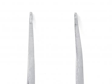 The image shows a narrow, metallic tweezer. It has two long, straight arms that taper slightly at one end and have a straight edge.