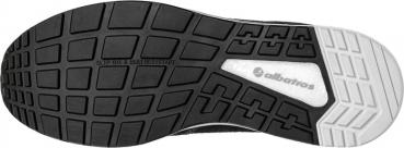 The image shows the sole of a shoe. It is predominantly black with a grid-like pattern that provides grip and slip resistance. A white area is visible on one side.