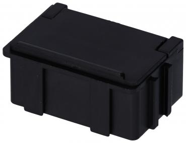The image shows a small, rectangular container in black. It has a smooth surface and a flap or lid that opens easily. There may be small indentations on one side for grip.