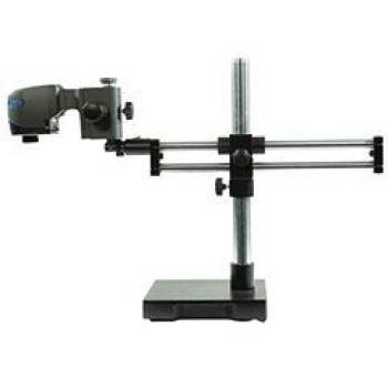 The image shows a medical device consisting of a vertical metal rod and horizontal rails. On one side, there is an optical device that can advance and swivel back.