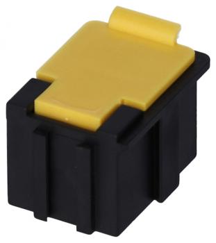 Das Bild zeigt einen kleinen elektrischen Stecker, der hauptsächlich schwarz ist und eine gelbe Oberseite hat. Die Form ist rechteckig mit einer flachen Abdeckung und einer Aussparung für das Einstecken.