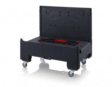 The image shows a black transport box with a folding lid. The box has wheels for mobility and red interior compartments for organizing tools or equipment.