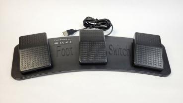 The image shows a foot switch set with three large, rectangular buttons. The buttons are black with a non-slip surface. The base reads "Foot Switch". A cable leads upwards.