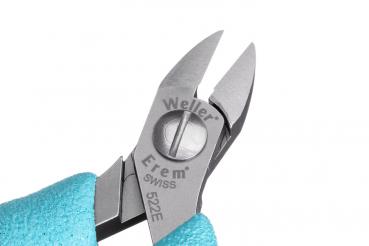 The image shows a detailed close-up of pliers with pointed, sharp blades and a silver-colored metal handle. The handle is coated with a blue, rubber-like surface.