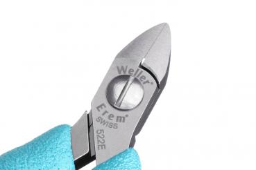 The image displays a narrow pair of pliers with a shiny, metallic cutting edge and a round handle. It features a light blue, rubberized grip for better hold.