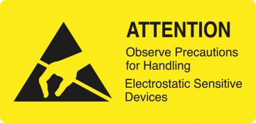 The image shows a yellow warning sign with a black triangle. Inside, there is a hand depicted holding a pen. Below it reads: 