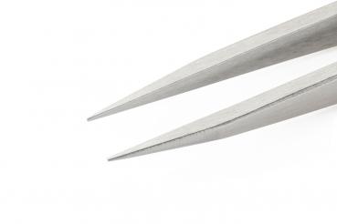 The image shows the tips of a stainless steel tweezer. The two ends are narrow and taper to a point, ideal for grasping small objects. The background is light and solid-colored.