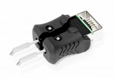The image displays a black device with two grip-friendly sides that appear to be rubber. At one end, a connector is visible, used for electrical applications.