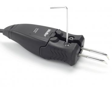 The image shows a black, handy tool with two metal tips and a cable. At the top, there is a lever and a small Allen wrench. It has an ergonomic shape.
