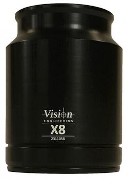 The image shows a black lens attachment with a conical shape. In the center it reads "Vision Engineering" and below that "X8", followed by a number. The upper part is wider than the base.