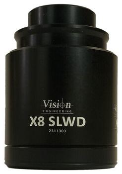 The image shows a black optical accessory, likely a lens or a lens. It has a cylindrical shape with a smooth surface and a white label on the front.