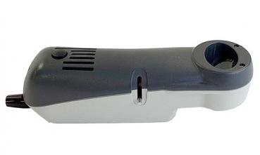 The image shows a gray, ergonomically shaped device that looks like a small hand scanner. It has a round opening at one end and several buttons on the top.