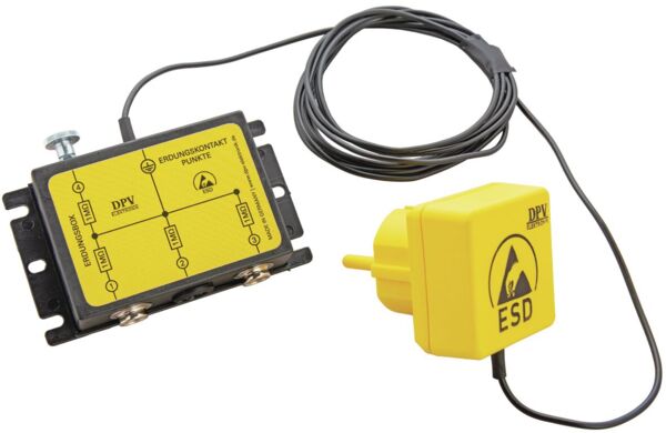 Das Bild zeigt ein elektrisches Gerät in gelber Farbe mit zwei Anschlüssen auf der linken Seite und einem Kabel, das zu einem gelben Stecker führt. Es hat eine rechteckige Form.