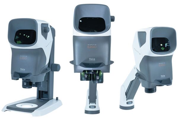 The image shows an optical device with a rectangular casing that is rounded on top. It has a large opening at the front through which one can look, and two round eyepieces at the bottom. The color scheme is gray and white.