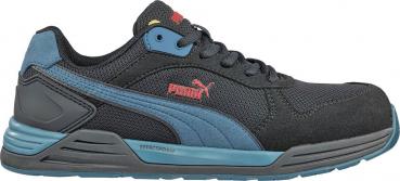 The shoe is black with blue accents. It has a sporty shape, a non-slip sole, and a padded tongue. A red Puma logo is attached to the side.