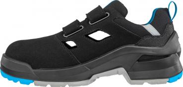 The shoe is black with blue and gray accents. It has a sturdy, non-slip sole and two Velcro straps. The side openings provide ventilation.