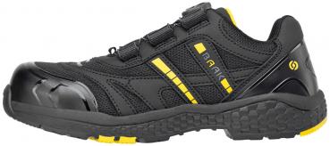 The shoe is black with yellow accents. It has a reinforced toe cap and elastic laces. The sole is grippy and provides good traction. Ideal for work or leisure.