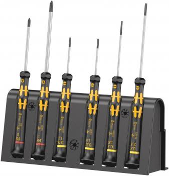 The image shows a holder with six screwdrivers. They have black handles with yellow details. The screwdrivers vary in length and have different tip shapes.