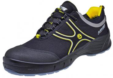 Der Schuh ist ein sportlicher Sneaker in Schwarz mit gelben und grauen Akzenten. Er hat ein leichtes, funktionales Design und eine robuste Gummisohle für guten Halt.
